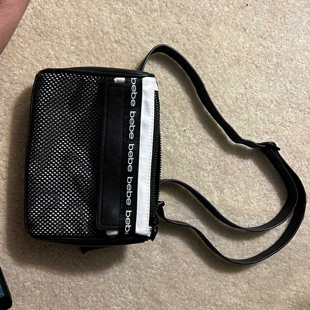 Bebe belt strap bag. Wore once. Netting in front with pocket and two Inside.